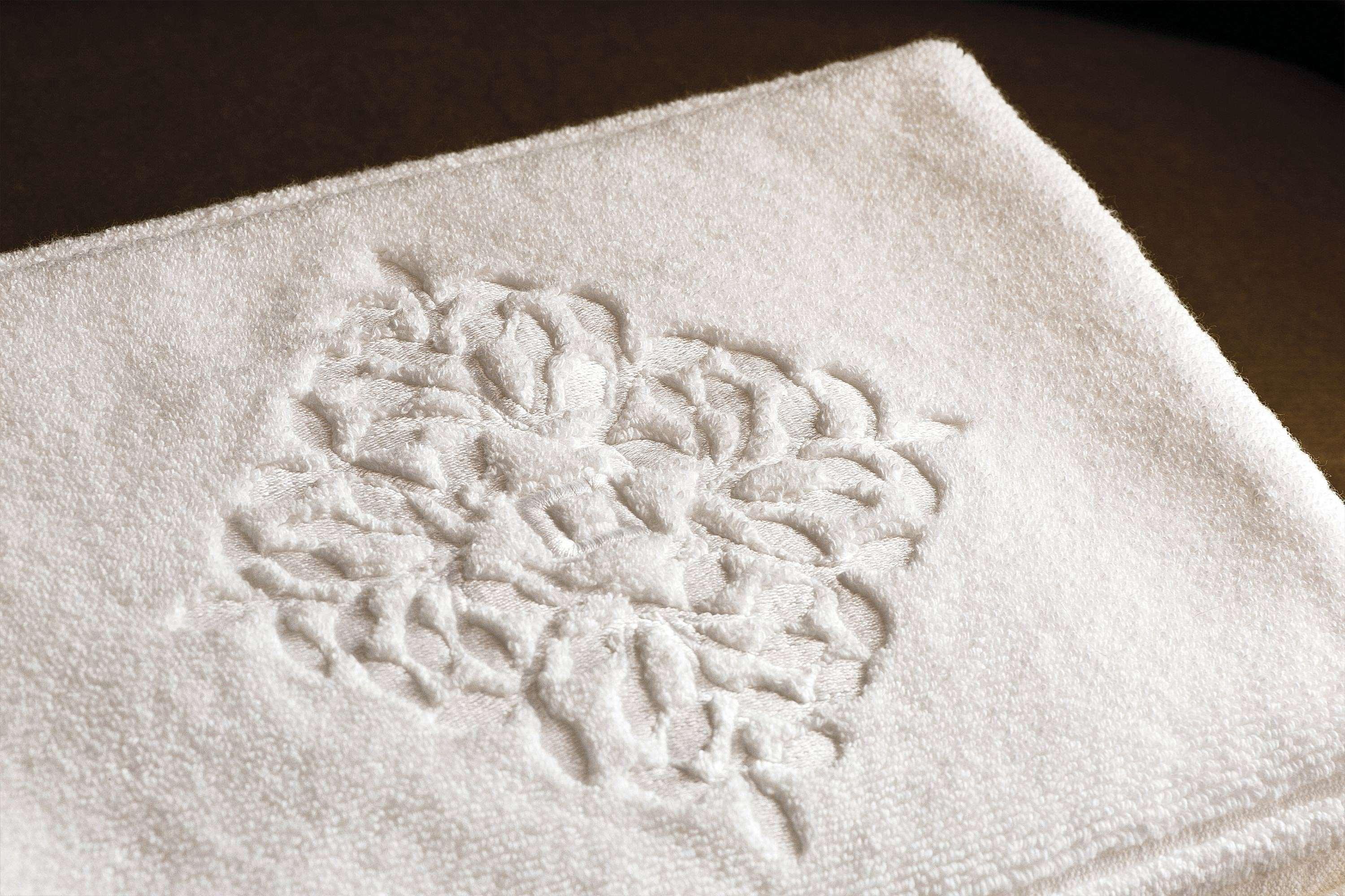 La Demeure Montaigne Hotel Paris Exterior photo A towel with a monogram